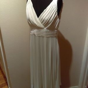 Ivory pleated tea length pleated dress